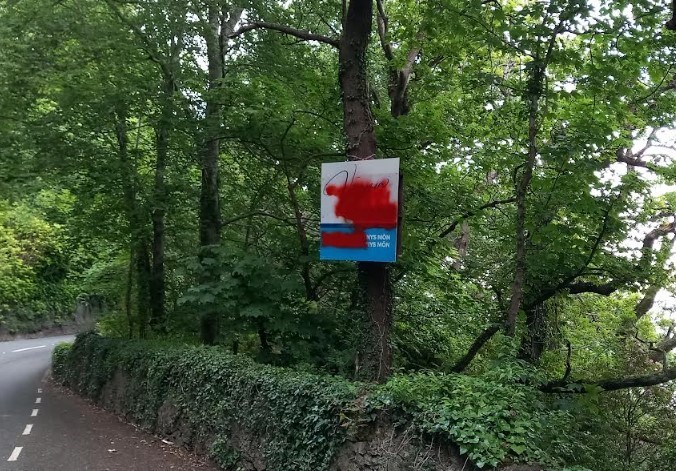 Obliterated by red paint - the election board which has been vandalised near Beaumaris (Image Dale Spridgeon) 