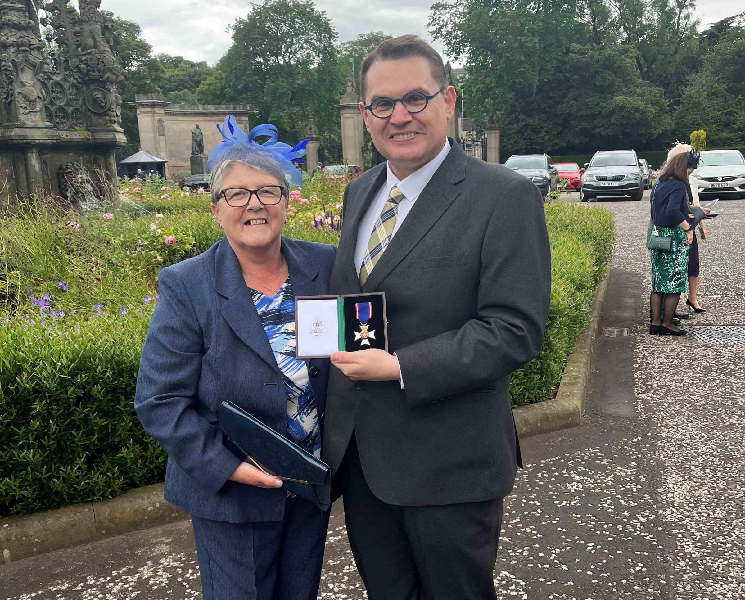 Paul Mealor with his mother, Patricia Mealor, following the presentation of the Lieutenant of the Victorian Order Medal by The King at Holyrood Palace in Edinburgh