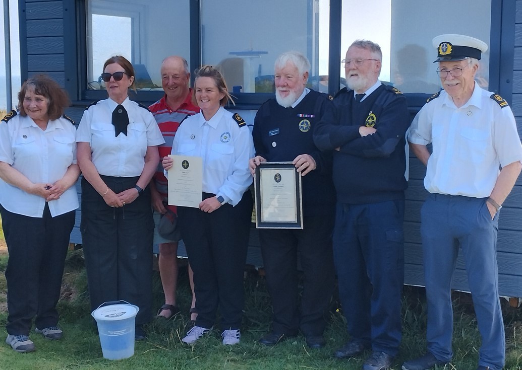 National Coastwatch Institute volunteer watchkeepers gathered to mark the start of the new Moelfre station. Pictured Are Christine Howard, Anne Hiley, Colin Heath, Vicky Cooper, who received a certificate for five year\s service, and Mike Thompson w