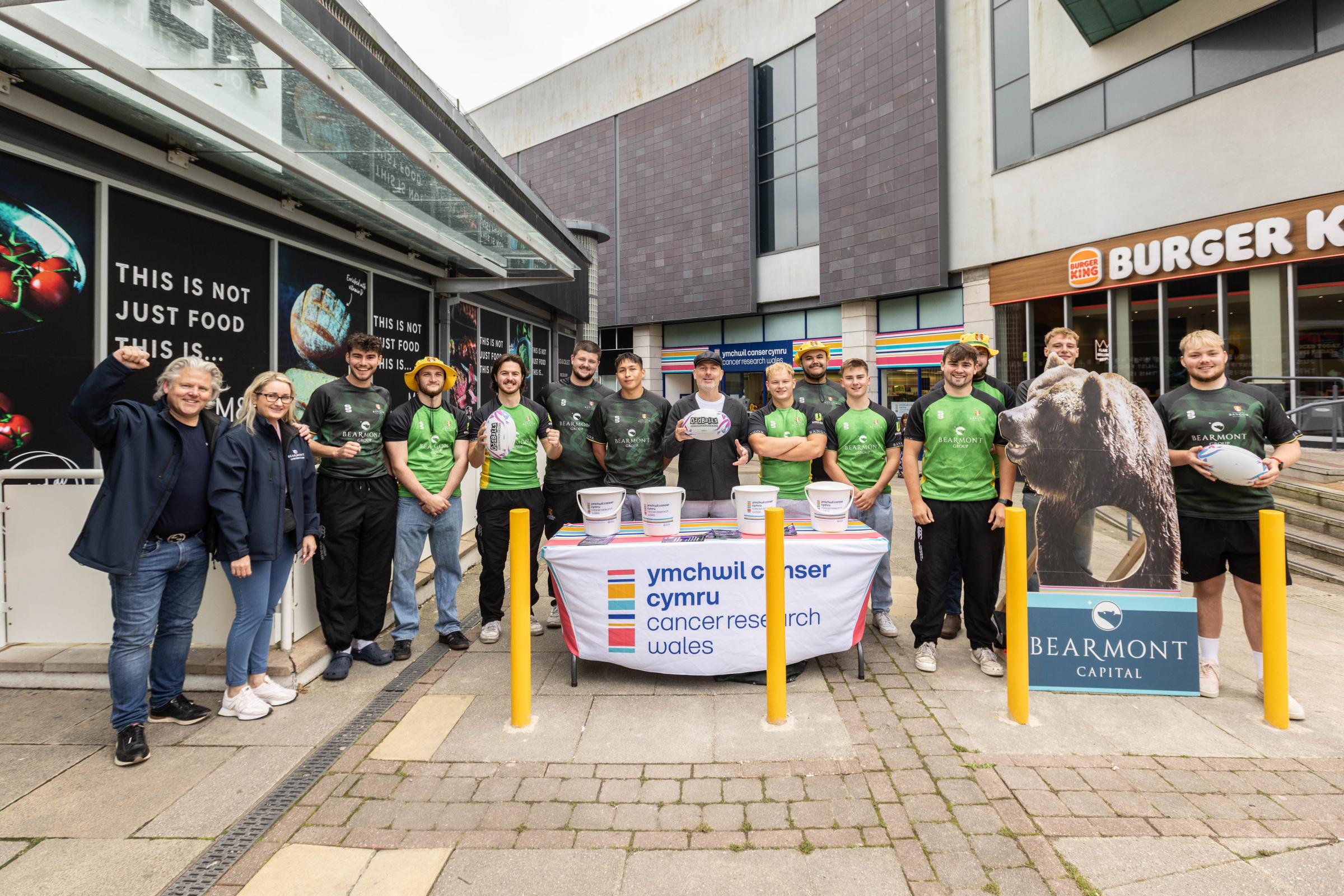 Cancer Research Wales shop opening in Bangor. Aled Hughes opened the shop and local property developer Rob Lloyd and the rugby team from Bangor University came along to support the opening. Photo: Iolo Penri